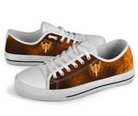 Viking low-top sneakers with orange-brown panels, white sole, and gold spear and emblem