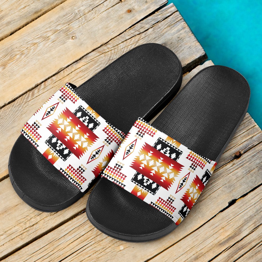 Pair of black slide sandals with white multicolor Native geometric print straps