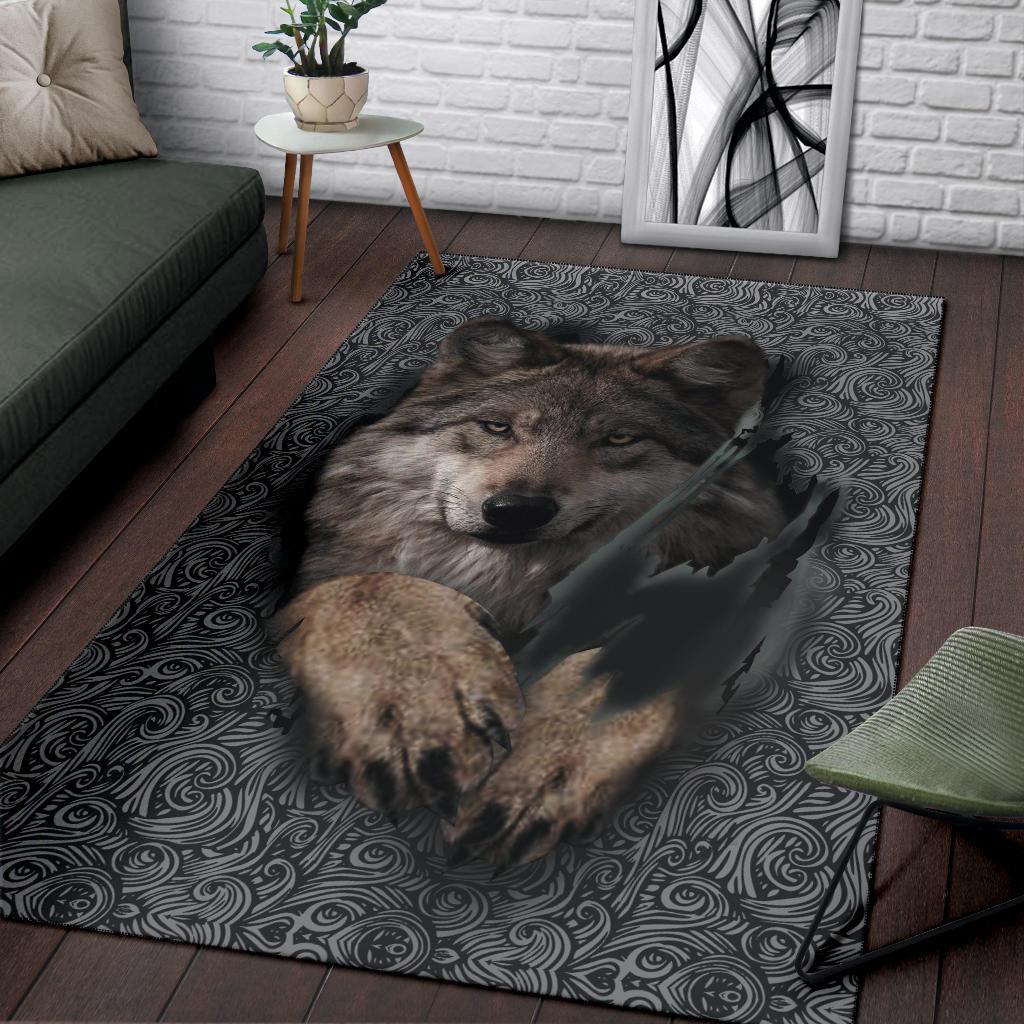 Wolf portrait area rug with dark scrolling pattern and centered wolf head