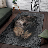 Wolf portrait area rug with dark scrolling pattern and centered wolf head