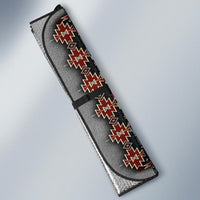 Multicolor sun shade side view: gray fabric with red and white geometric trim