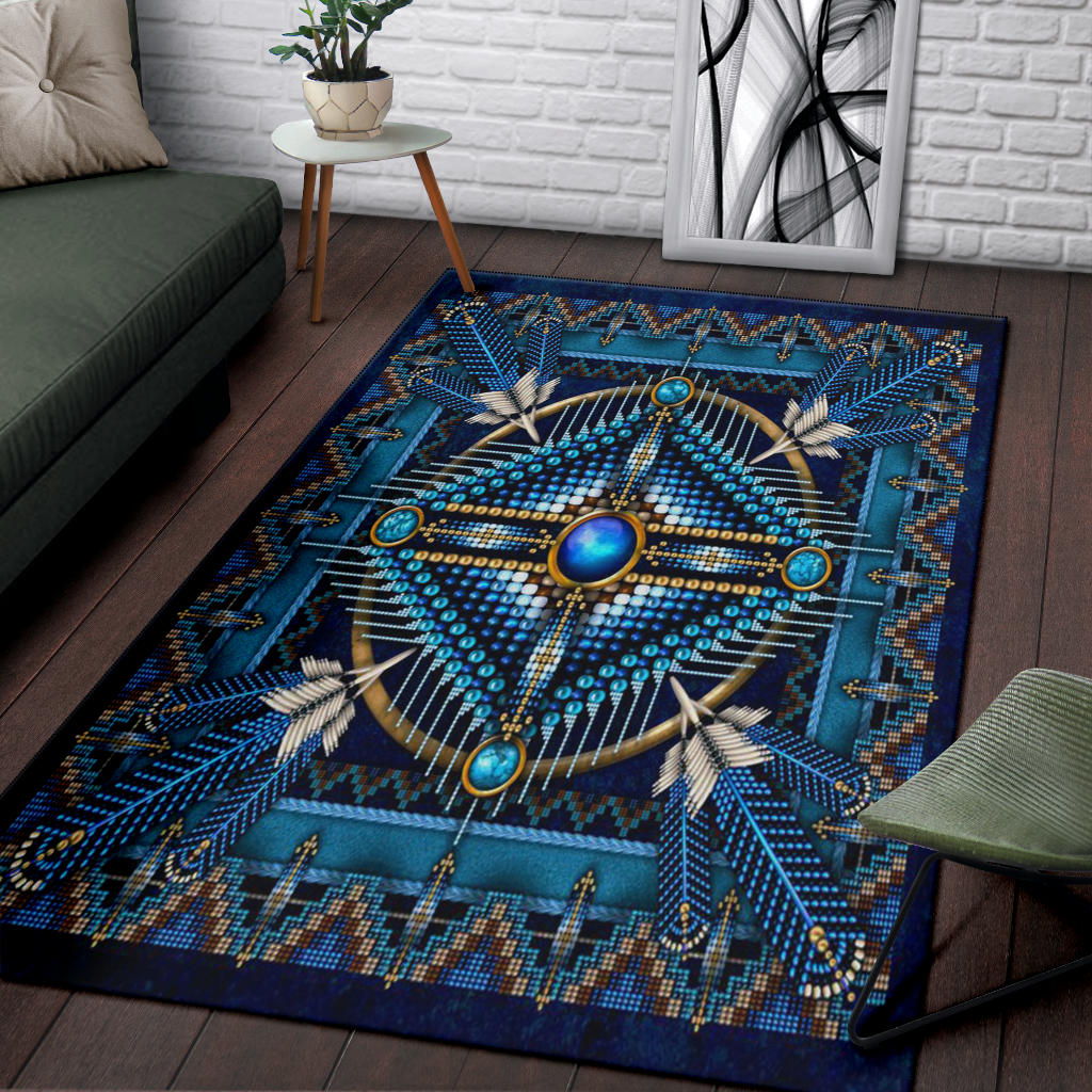 Blue patterned rug with circular starburst medallion and turquoise geometric border