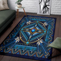 Blue patterned rug with circular starburst medallion and turquoise geometric border