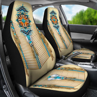 Turquoise tribal breastplate seat covers shown on front seats with matching cushion pattern