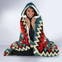 Teal hooded blanket with sherpa-lined hood, red zigzag and diamond pattern