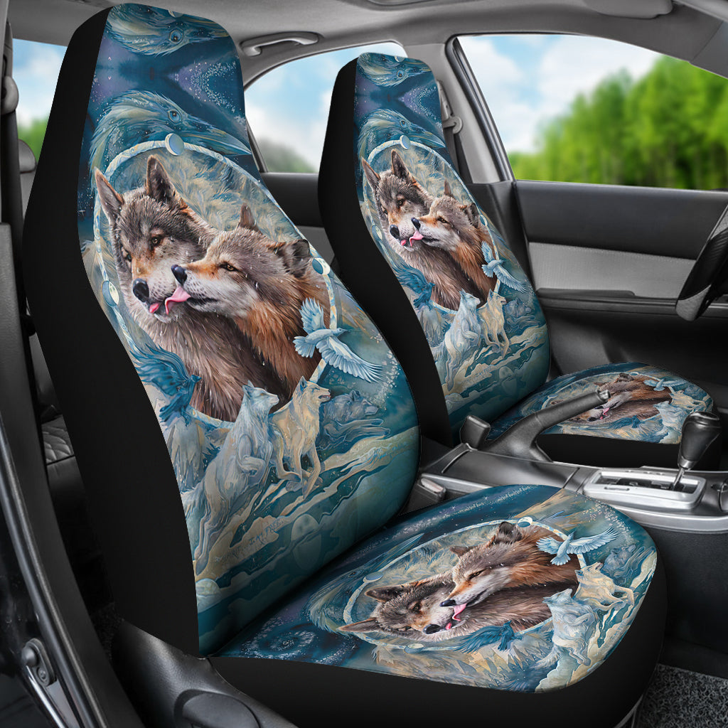 Front car seat covers featuring wolf face artwork over blue water-and-feather design