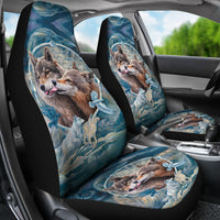 Front car seat covers featuring wolf face artwork over blue water-and-feather design