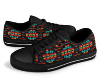 Low-top sneakers with black laces and multicolor Native tribal stripe print on the sides.