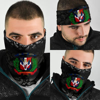 Black paisley neck gaiter with Dominican crest, worn by man (headband style)