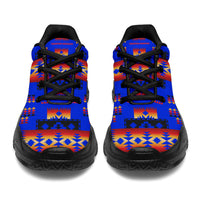 Dark blue chunky sneakers front view with Native American geometric pattern and black laces
