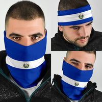 Blue and white striped El Salvador neck gaiter bandana with crest emblem, worn on face