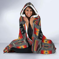 Native-style hooded blanket with white fleece-lined hood and multicolor geometric pattern