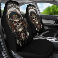 Front car seats with Native chief skull artwork on black seat-back covers