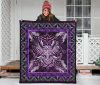 Purple Native American pattern quilt draped flat, featuring central owl/eagle-style mandala