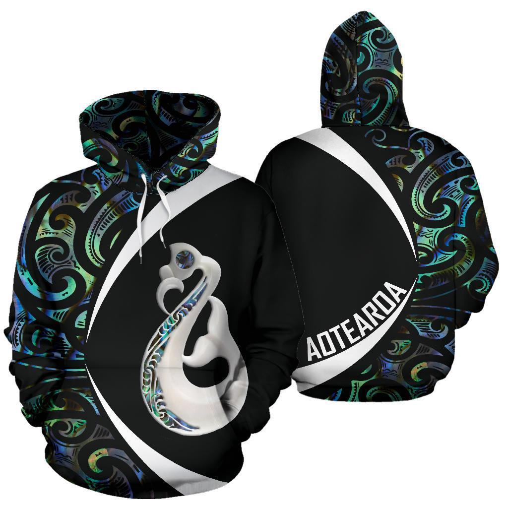 Black pullover hoodie front and back: manaia shell graphic, white circle and AOTEAROA