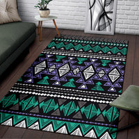 Tribal area rug with teal, purple, white, and black patterns and zigzag border lines