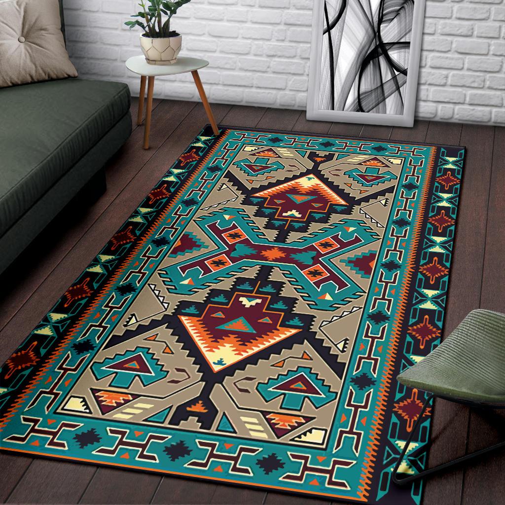 Large geometric area rug in teal, orange, and tan with tribal border design