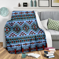 Blue geometric throw blanket with multicolor diamond blocks and decorative border stripe