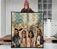 Quilt laid flat with Native American portrait artwork across the center, black trim border