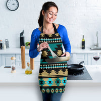 Teal Aztec geometric apron with black straps and tan zigzag bands; worn during food prep