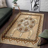 Tan Native-inspired beaded area rug with central starburst medallion and diamond border