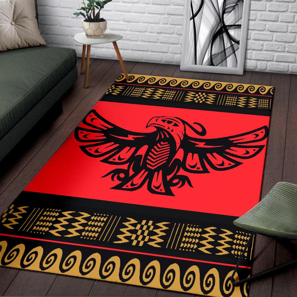 Red and black patterned area rug with gold trim and eagle design