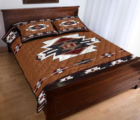 Quilt bed set in brown with bold white star motif and geometric border print