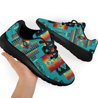 Turquoise multicolor sneakers with geometric tribal print, black outsole, top close-up view