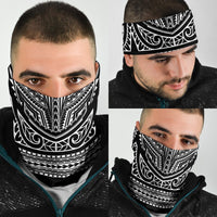 Black-and-white tribal bandana worn by man; nose and chin covered