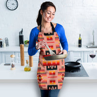 Colorful tribal-pattern apron with tan background, red and yellow shapes, black neck strap