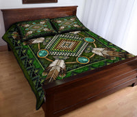 Folded view: green quilt bed set with turquoise ring motifs and feather fan patterns