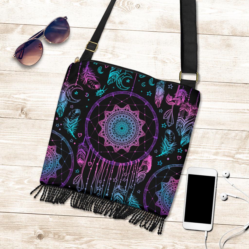 Dreamcatcher crossbody bag laid flat, multicolor feathers and circular motif with fringe