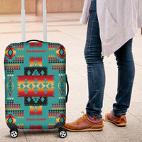 Teal suitcase cover with Native tribes pattern, multicolor aztec-style geometric design