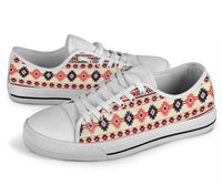 White low-top sneakers with multicolor Aztec geometric print, front and side view