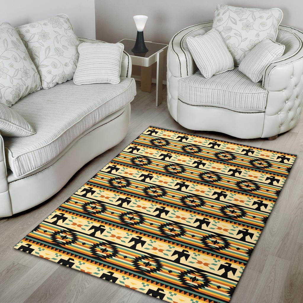 Yellow patterned area rug with black accents and repeating Native American motifs