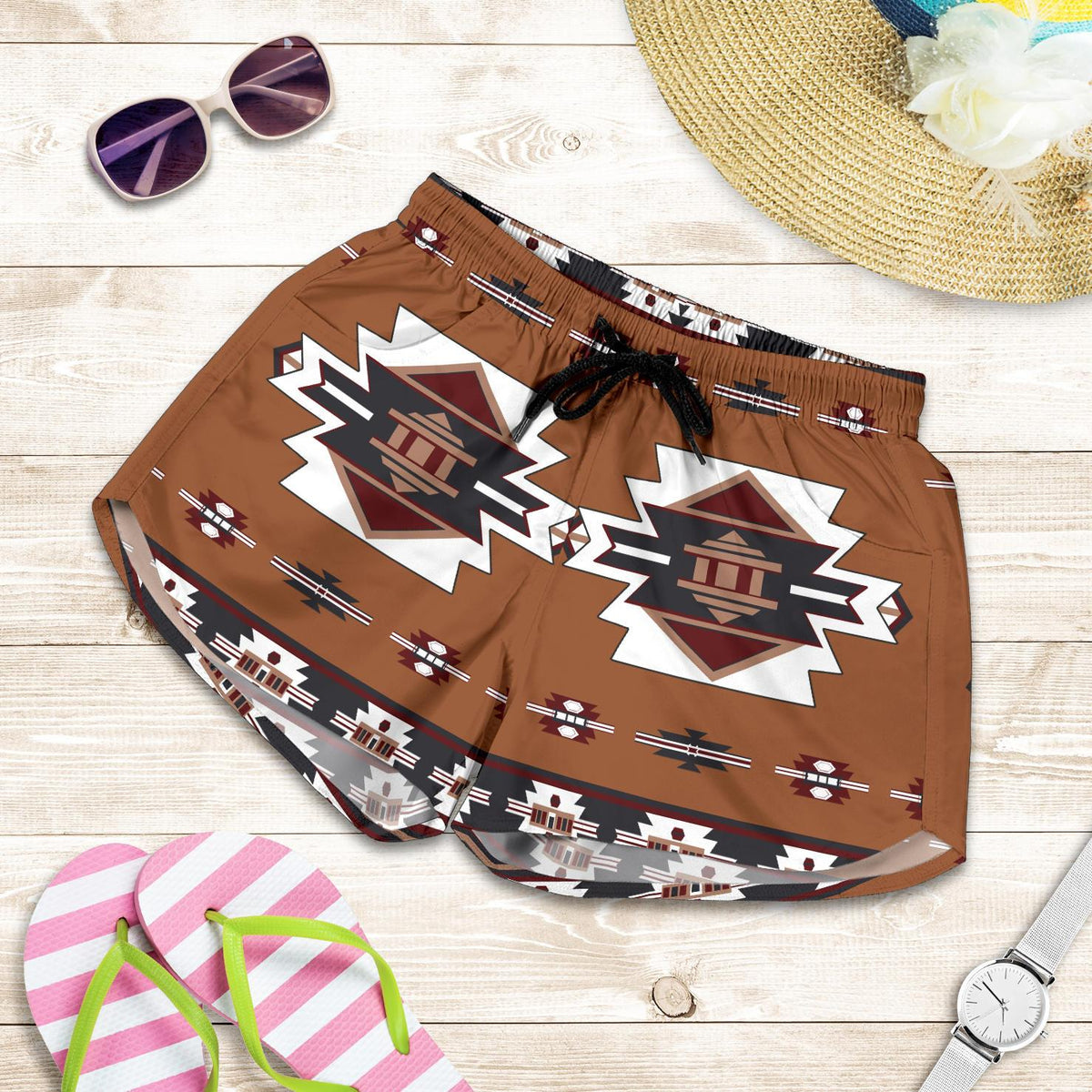 Flat-lay view of women’s brown all-over print shorts with temple motifs and drawstring waist