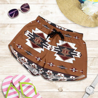 Flat-lay view of women’s brown all-over print shorts with temple motifs and drawstring waist