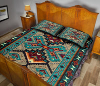 Quilt bed set with teal, black, tan, and orange southwestern diamond pattern