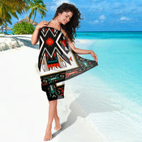 Colorful tribal sarong wrap with bold black, white, red, and green Aztec-style design