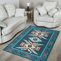 Teal Native American geometric area rug with red trim and cream center medallion