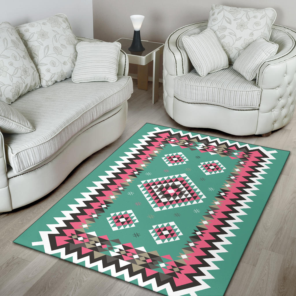 Teal geometric area rug with zigzag border and square diamond pattern in pink and black