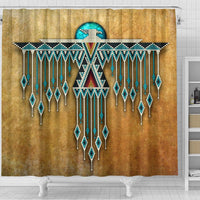 Tan shower curtain with central Thunderbird medallion, colorful accents, and beaded fringe