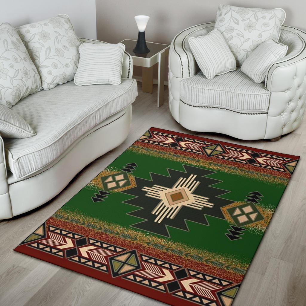 Green geometric area rug with red patterned border and central starburst medallion