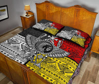 Quilt bed set with matching pillows, thunderbird artwork, and tribal geometric blocks in red