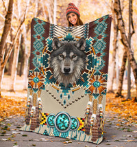 Wolf blanket with native-style bead patterns, turquoise circles, and long tassel fringe