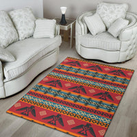 Red Native-inspired area rug with bold geometric motifs, multicolor stripes, and edging