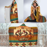 Multicolor hooded blanket with Kokopelli scene; hood at top and colorful border