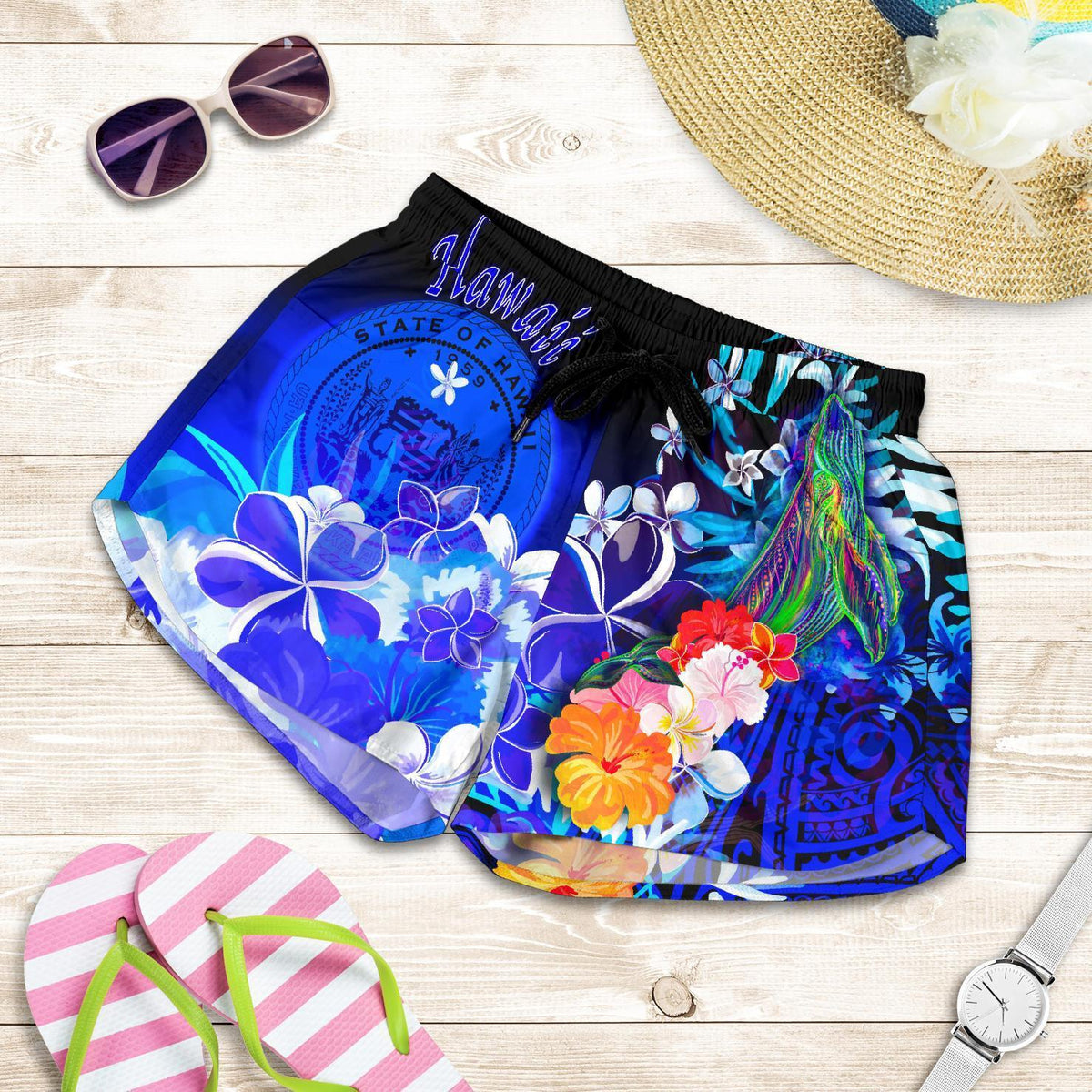 Blue women’s shorts: black elastic waist, tropical flowers and humpback whale print