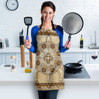 Tan beaded apron front featuring sunburst center pendant and feather-like bead details