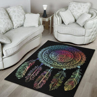 Area rug featuring central mandala and multicolor feathers on black ground